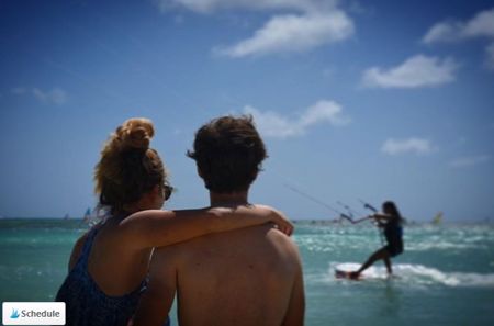 insta-@daphneonacloud-photo-of-couple-watching-kite-surfing-at-aruba-hi-winds-visitaruba-blog