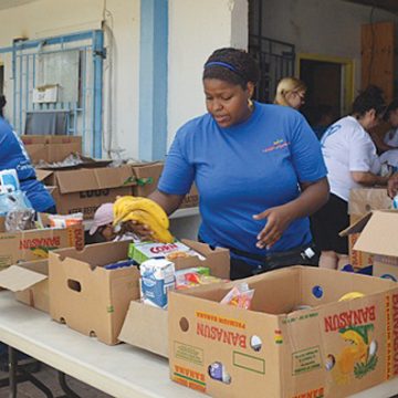 Care Foundation preparing the foodbaskets to donate.jpg