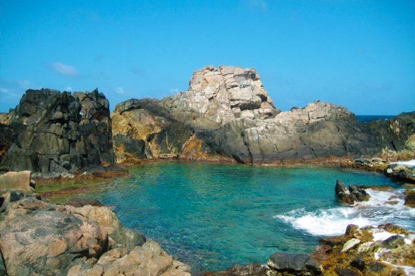 Aruba's Natural Pool is named as one of the world's twelve best spots for wild swimming